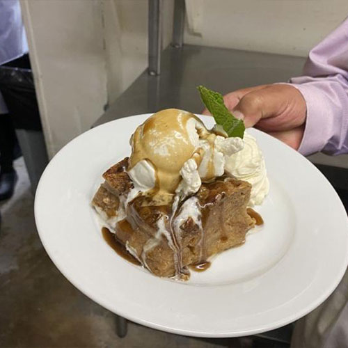 ANNUNCIATION’S Bananas Foster Bread Pudding